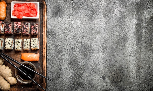 Traditional Japanese food. Sushi and rolls . On rustic background.