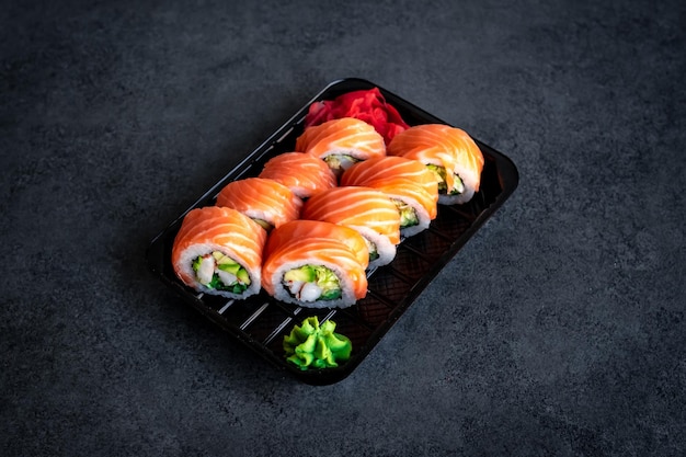 Traditional Japanese rolls with salmon and shrimp in box