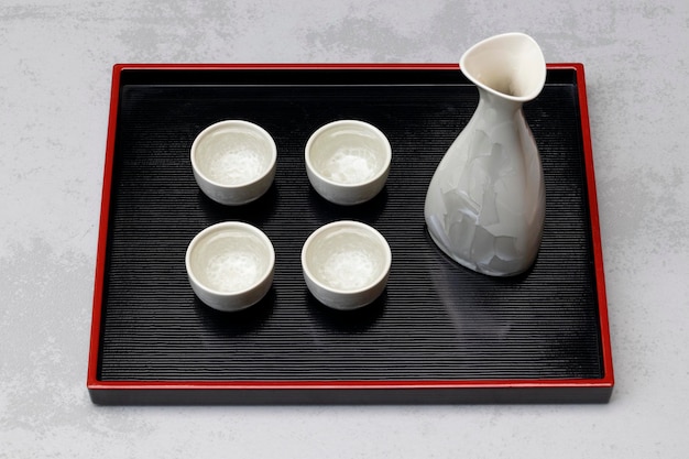 Traditional Japanese sake set on a tray