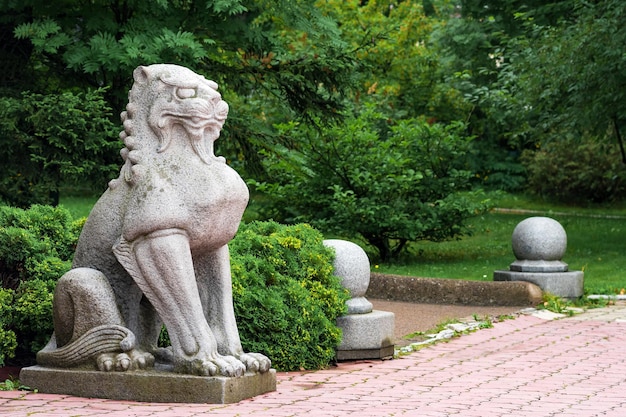 Traditional Japanese statue of a stone lion at the entrance to the Sakhalin Museum of Local Lore