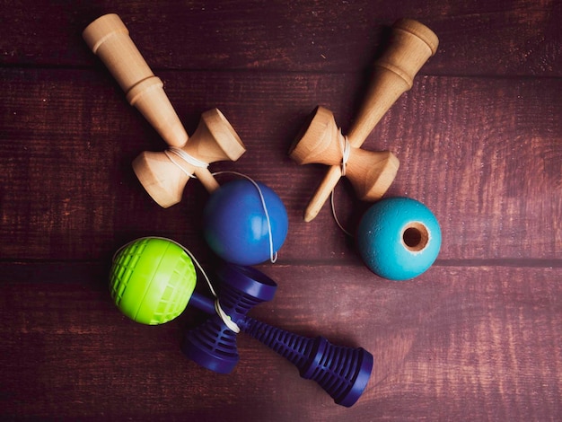 Traditional Japanese wood toy Kendama on wooden background Symbol of Japanese boy toy