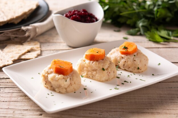 Traditional Jewish gefilte fish on wooden table