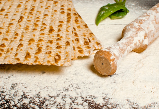 Traditional Jewish kosher matzo for Easter pesah on a wooden tab