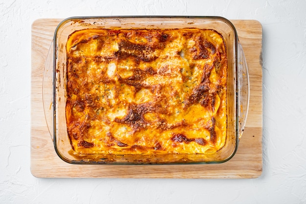 Traditional lasagna made with minced beef sauce topped with basil leafs