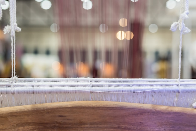 Traditional loom machine vintage style is tool for weave of making Thai silk from cocoon