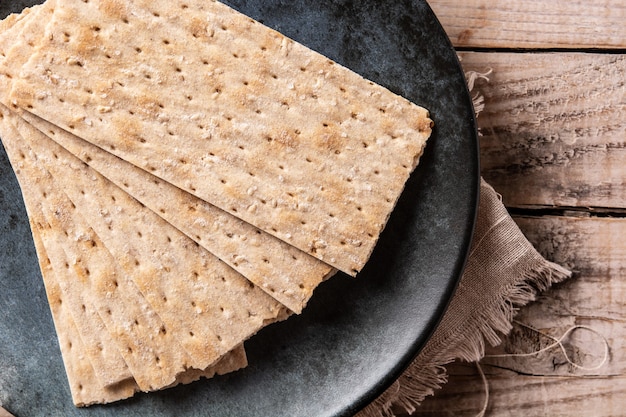 Traditional matzah bread on wooden table