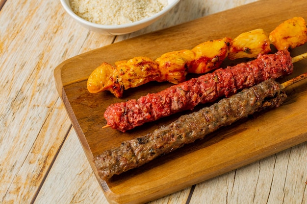 traditional meat skewers, known in brazil as espetinho de carne. also with chicken meat and sausage