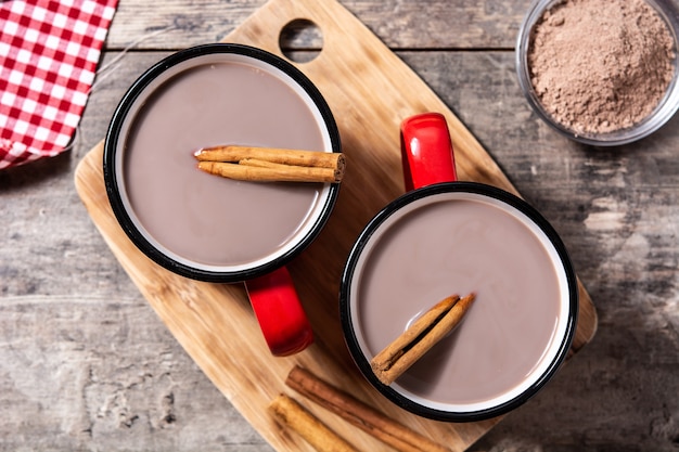 Traditional Mexican atole drink on wooden table