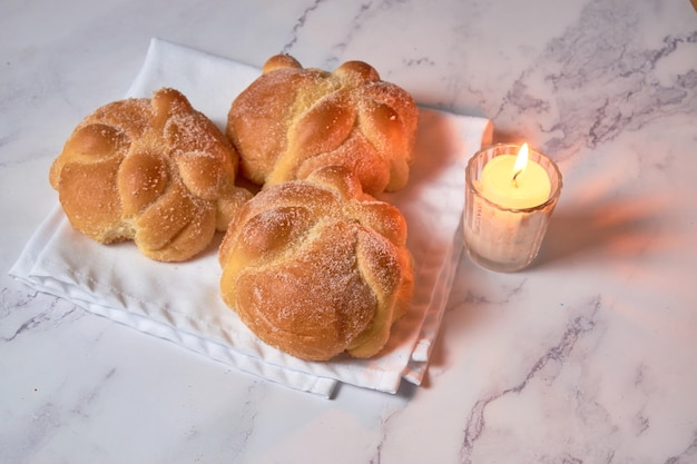 Traditional mexican bread of the dead quotpan de muertoquot on a marble background