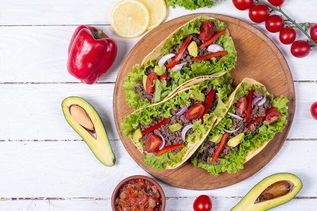 Traditional mexican tacos with beef tomato and avocado