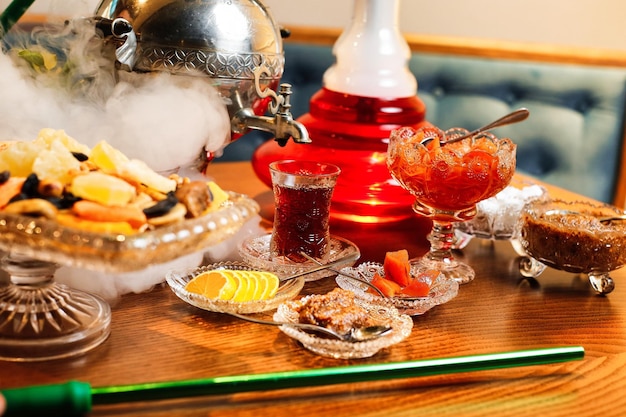 Traditional Middle Eastern Hookah Setup With Snacks
