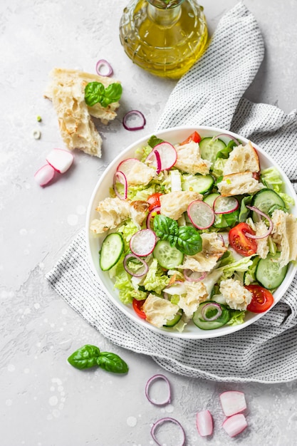 Traditional Middle Eastern salad with toasted pita and vegetables