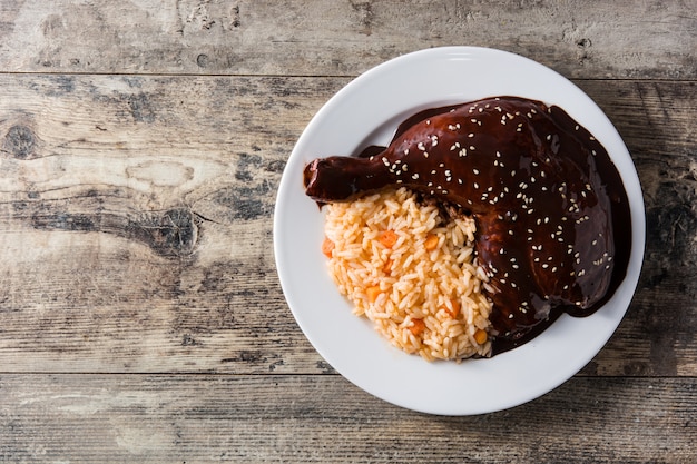 Traditional mole Poblano with rice in plate