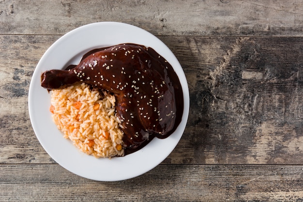 Traditional mole Poblano with rice in plate