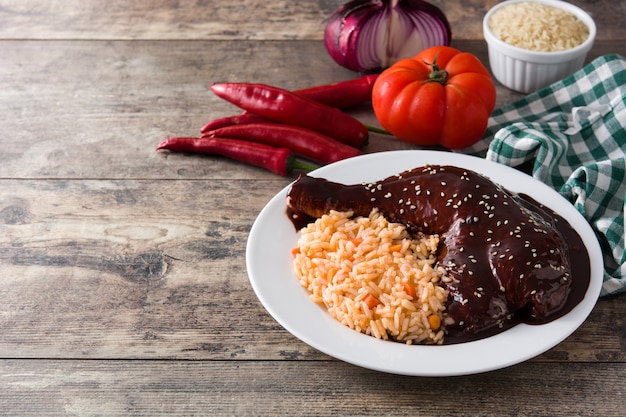 Traditional mole Poblano with rice in plate