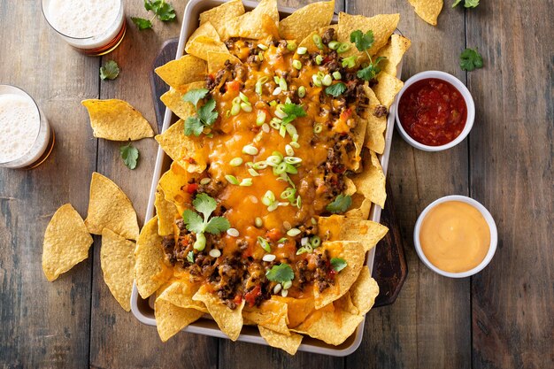 Traditional nachos with ground beef and red pepper