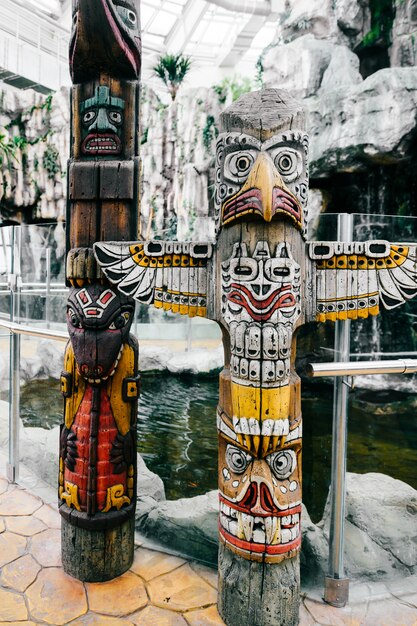 Traditional national indian totem.  Totem pole sculpture art. Ancient wooden mask.  Mayan and aztecs symbolic religious gods faces.