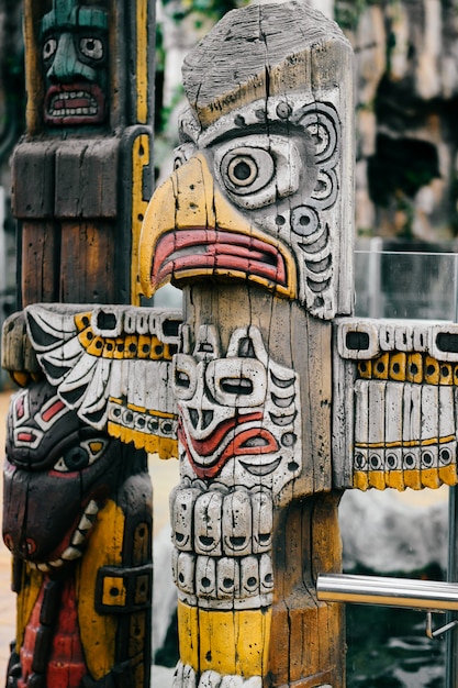 Traditional national indian totem.  Totem pole sculpture art. Ancient wooden mask.  Mayan and aztecs symbolic religious gods faces.