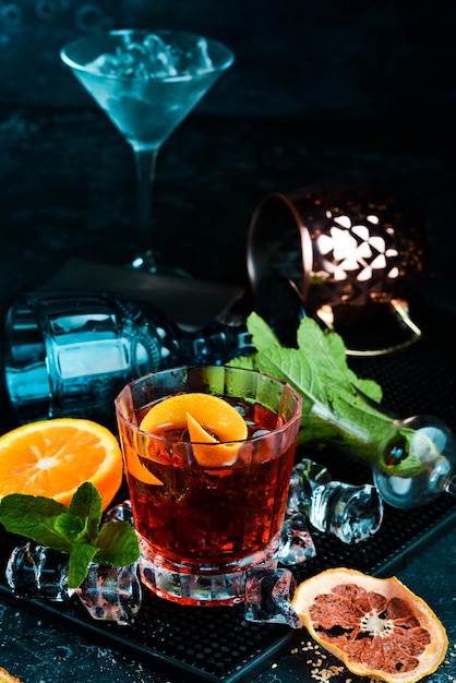 Traditional negroni cocktail on black stone background menu bar\
alcohol