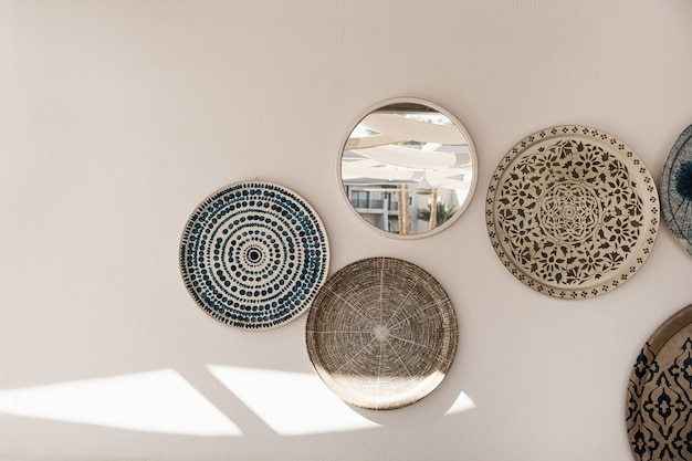 Traditional oriental ornamental ceramic plates on white wall