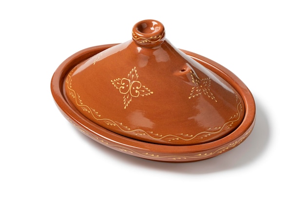 Traditional oval tajine or tagine a North African ceramic cooking pot