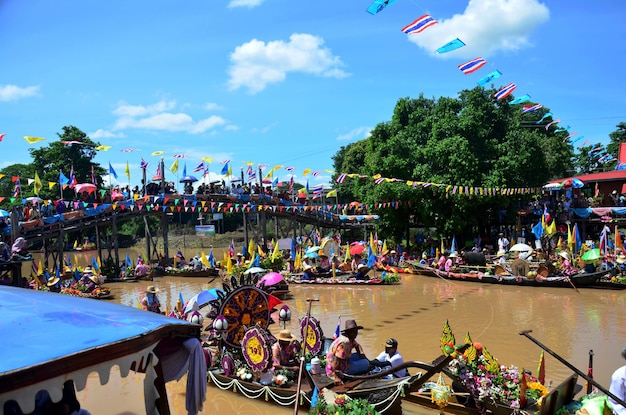 Traditional parade procession lent candle festival for Asalha Puja and Buddhist Lent Day in waterway by boat at Wat Lat Chado on July 19 2016 in Aytthaya Thailand