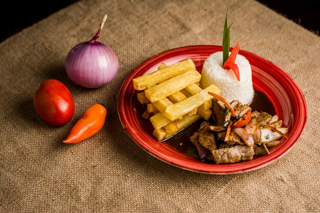 traditional peruavian criolla food call lomo saltado with rice meat and potatos