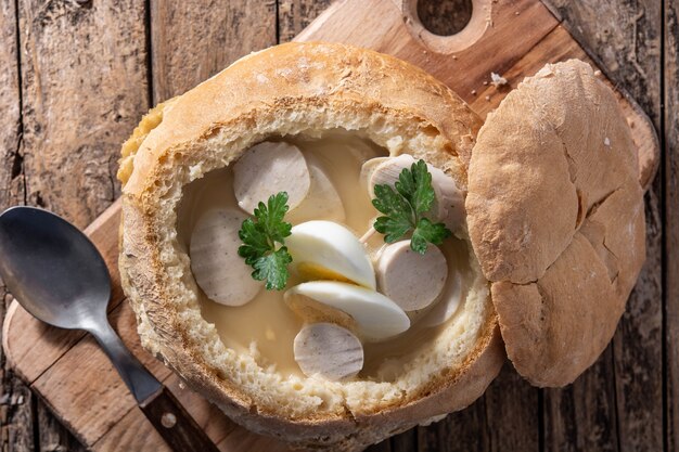 Traditional Polish soup on wooden table