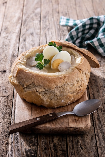 Traditional Polish soup on wooden table