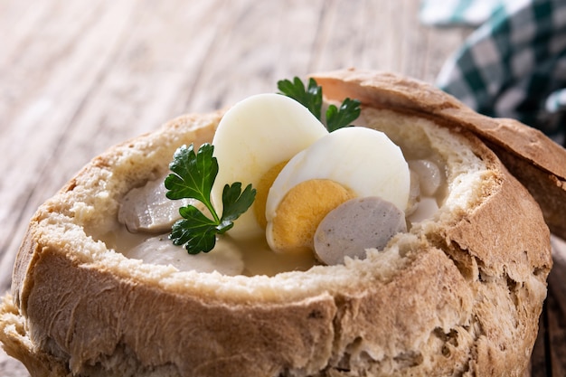 Traditional Polish soup on wooden table