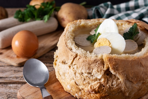 Traditional Polish soup on wooden table