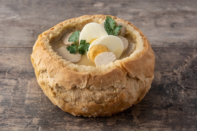 Traditional Polish soup on wooden table