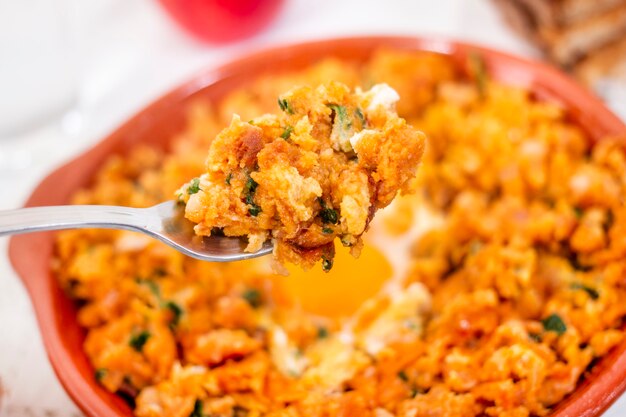 Traditional portuguese meal of mixed alheira sausage with egg and parsley.