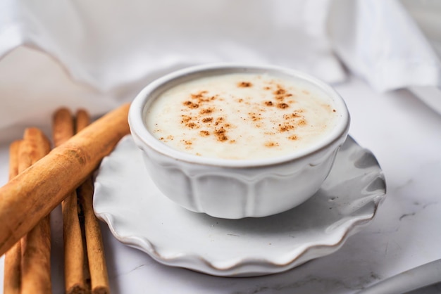 Traditional rice pudding or arroz con leche with cinnamon light background tasty and nutritious breakfast