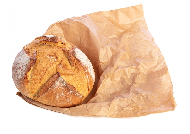 Traditional round bread on brown paper