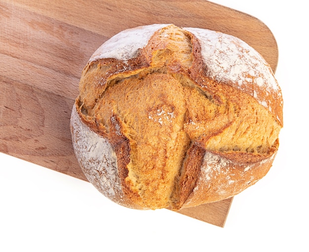 Traditional round bread with cutting board on a white background