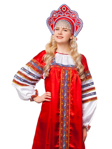 Photo traditional russian folk costume portrait of a young beautiful blonde girl in red dress isolated on white background