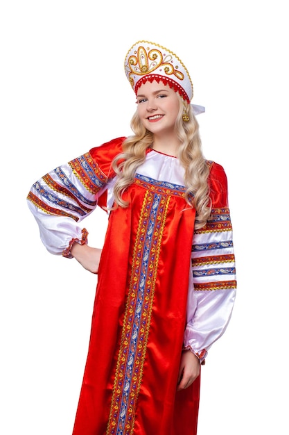 Photo traditional russian folk costume portrait of a young beautiful blonde girl in red dress isolated on white background