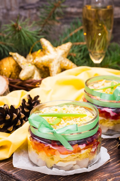 Traditional Russian salad - herring under a fur coat in bowls