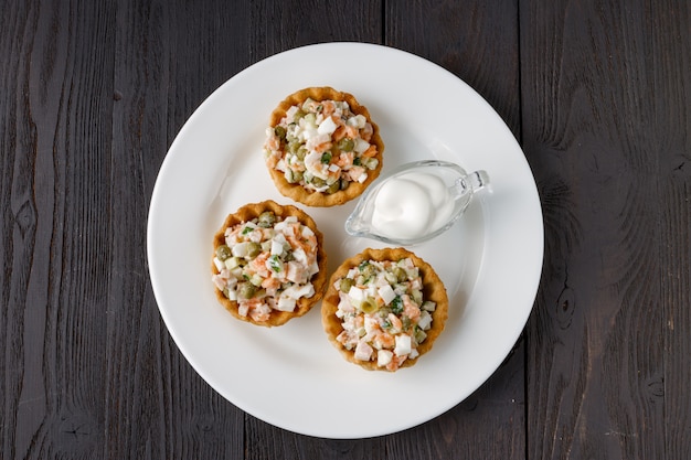 Traditional russian salad Olivier in tartlet