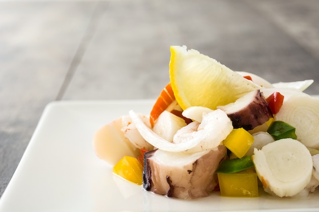 Traditional seafood ceviche from Peru on wooden table