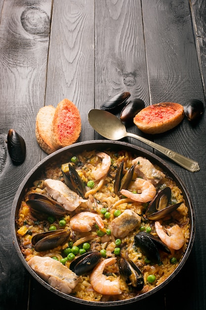 Traditional seafood paella in the pan