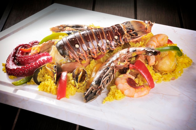 Traditional seafood paella with octopus lobster rice and shellfish