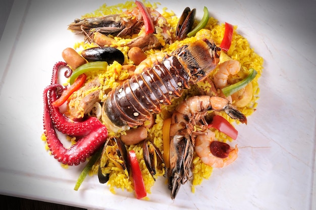 Traditional seafood paella with octopus lobster rice and shellfish