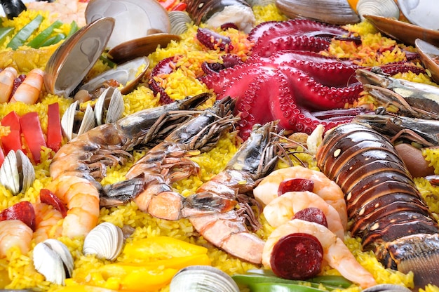 Photo traditional seafood paella with octopus lobster rice and shellfish