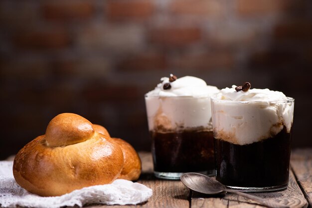 Premium Photo  Traditional sicilian granita coffee flavor with brioche  close up