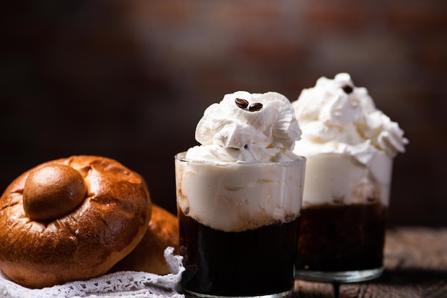 Traditional sicilian Granita coffee flavor with brioche close up