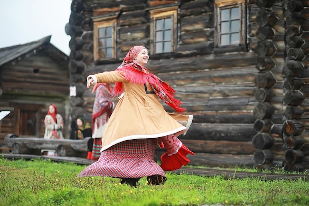 Traditional Slavic rituals in the rustic style Outdoor in summer Slavic village farm Peasants in elegant robes