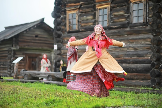 Traditional Slavic rituals in the rustic style Outdoor in summer Slavic village farm Peasants in elegant robes