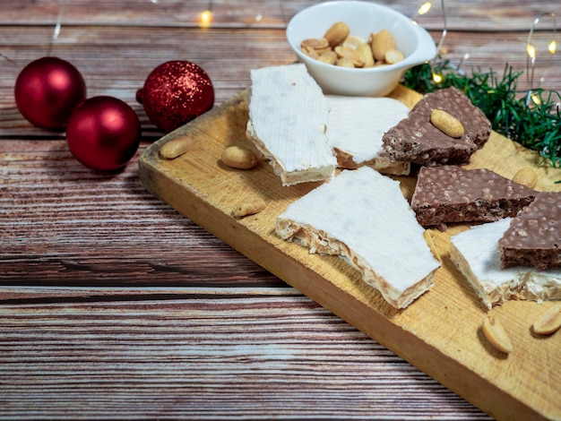 Traditional Spanish Christmas sweet Turron with Christmas lights in the background